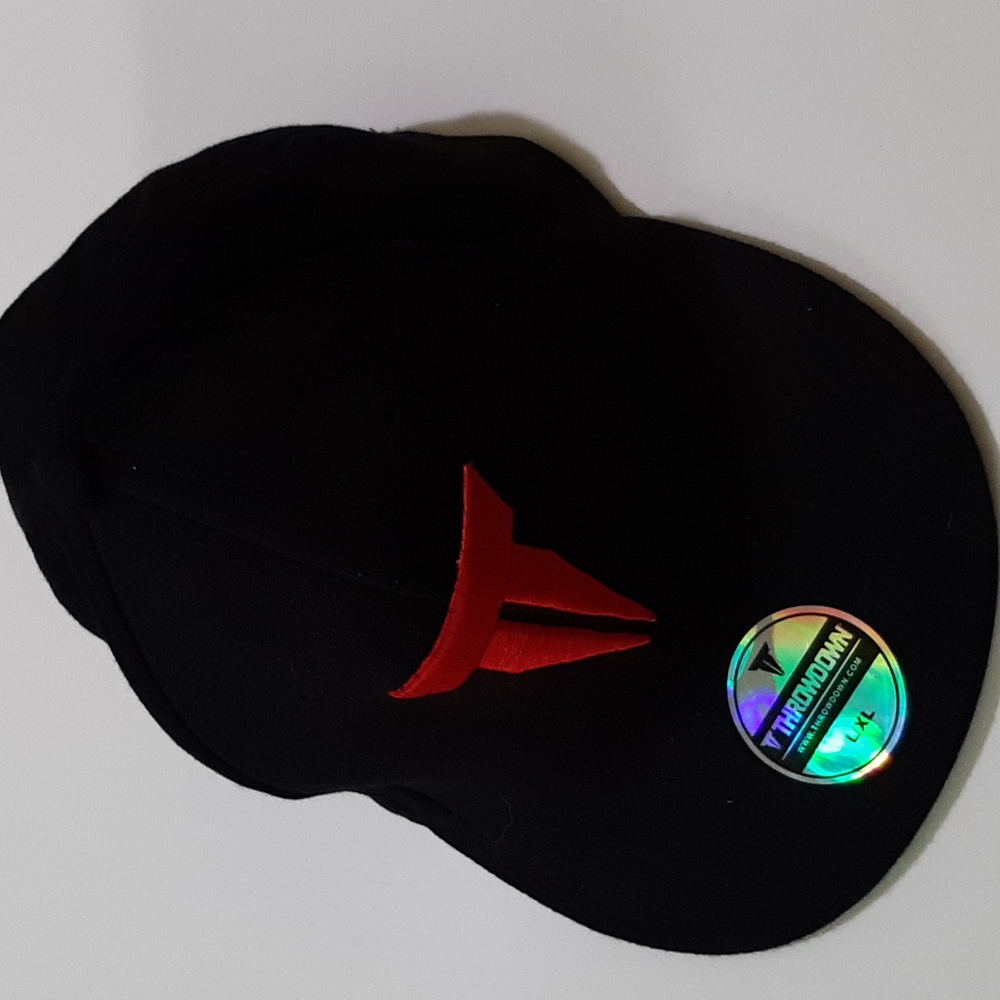 Throw down cap. Never worn. Size L/XL